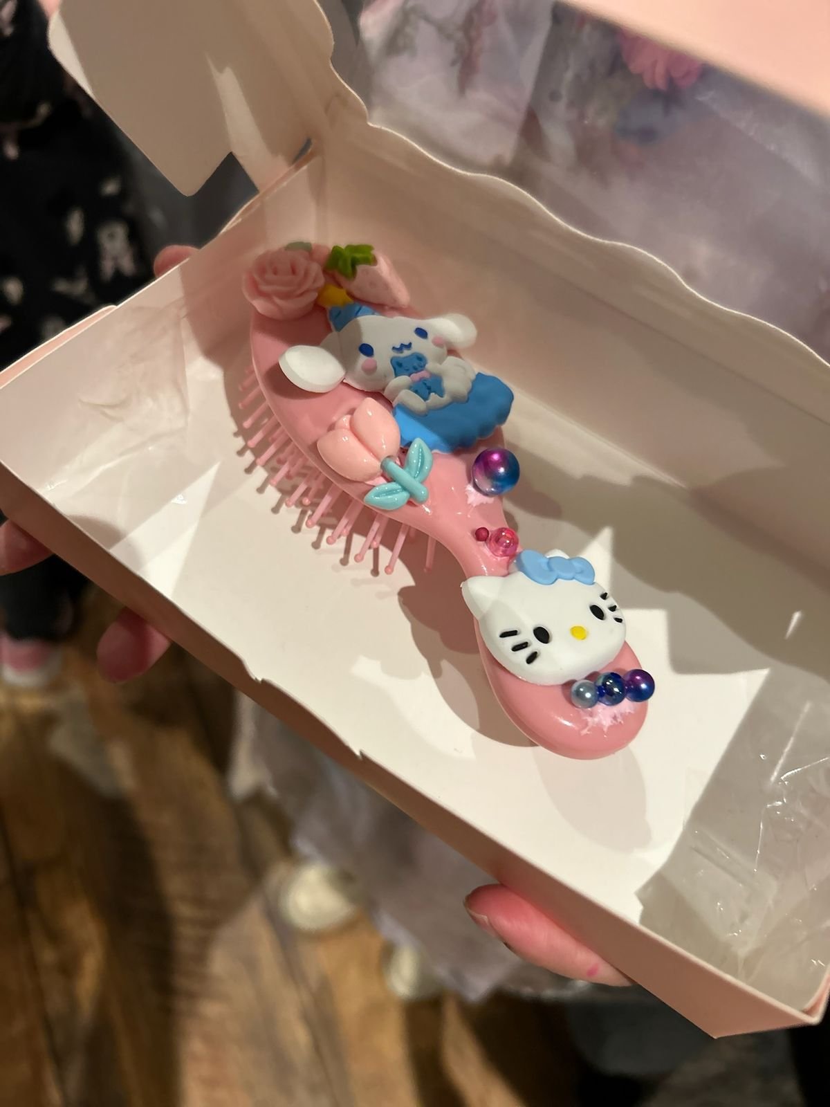 A Hello Kitty themed decorated hairbrush gift box