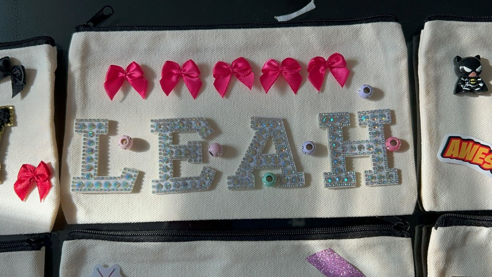 A personalised nameplate keepsake decorated with bows and gems