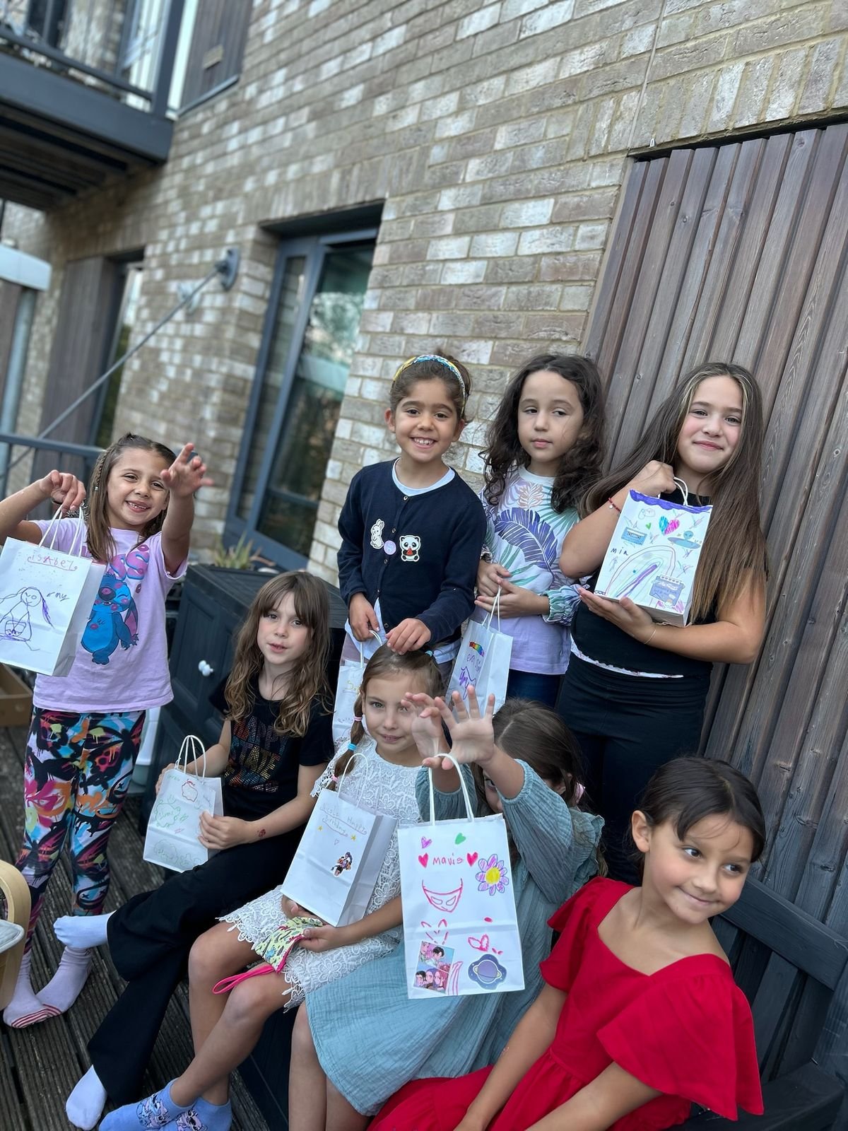 A group of children celebrating together at a Jazzy Slime party