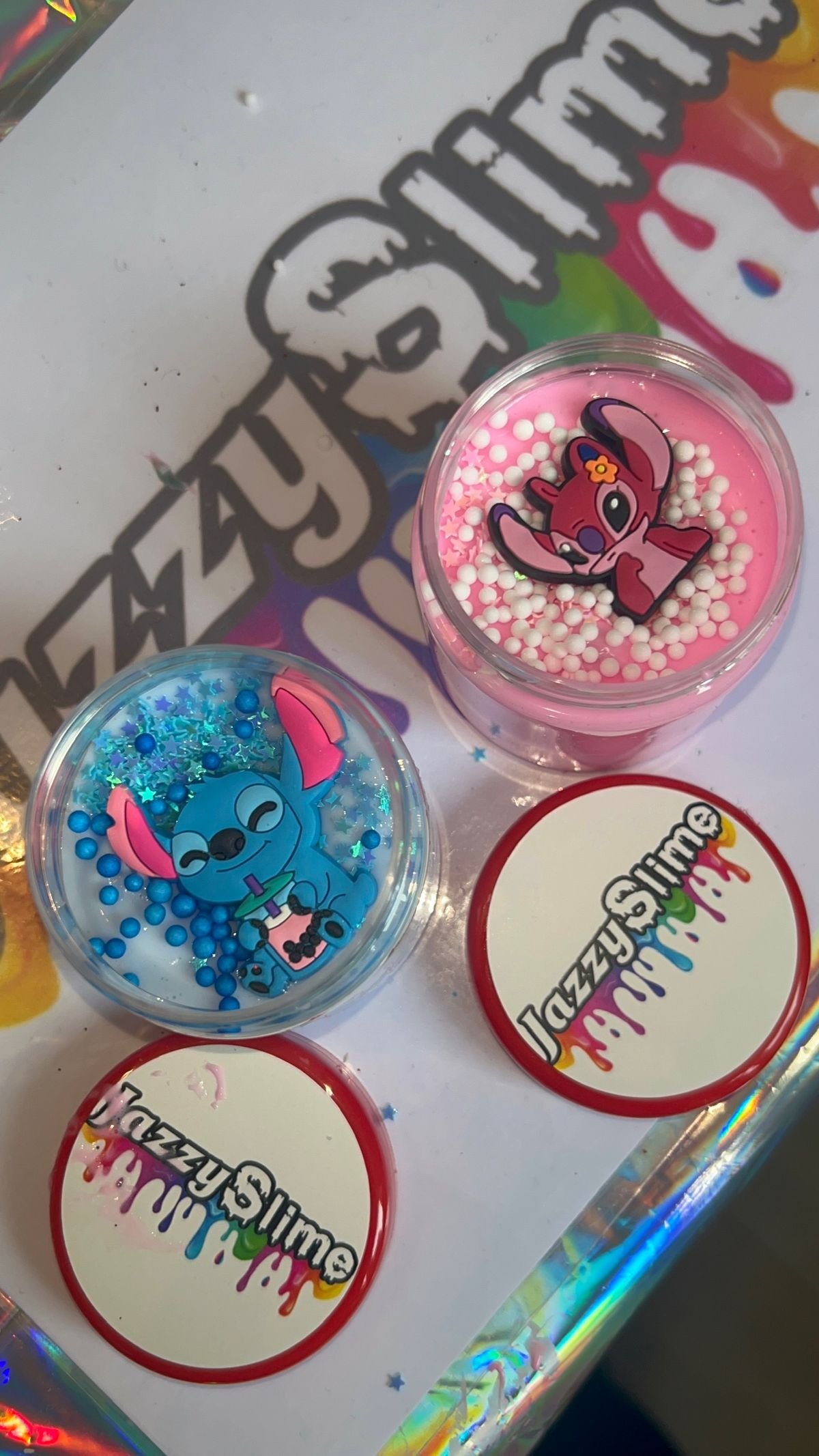 Two personalised Jazzy Slime take-home pots side by side