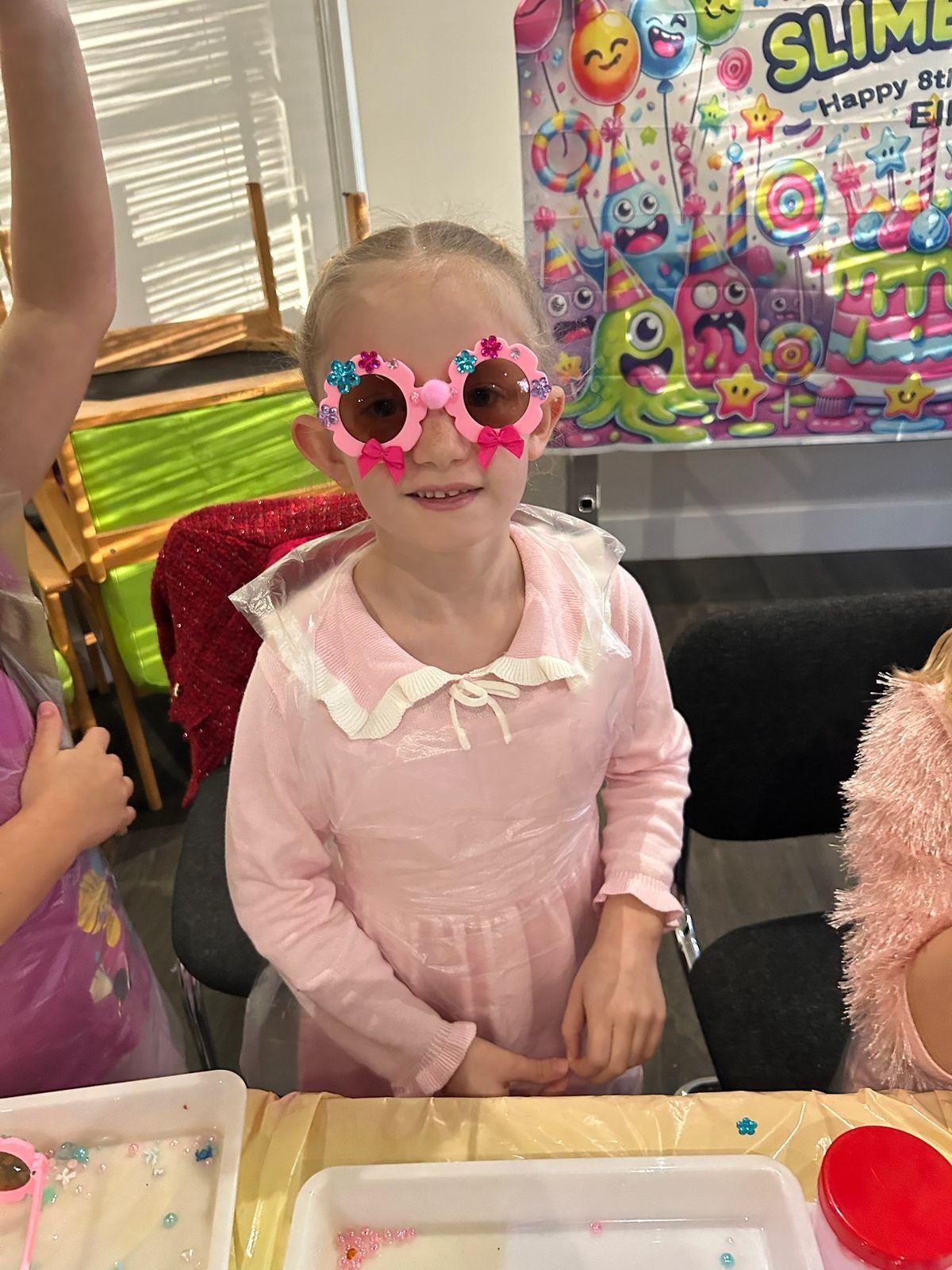 A girl wearing sunglasses she decorated herself