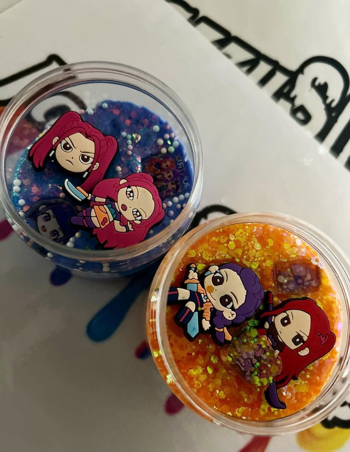 Jazzy Slime pots decorated with K-pop character stickers